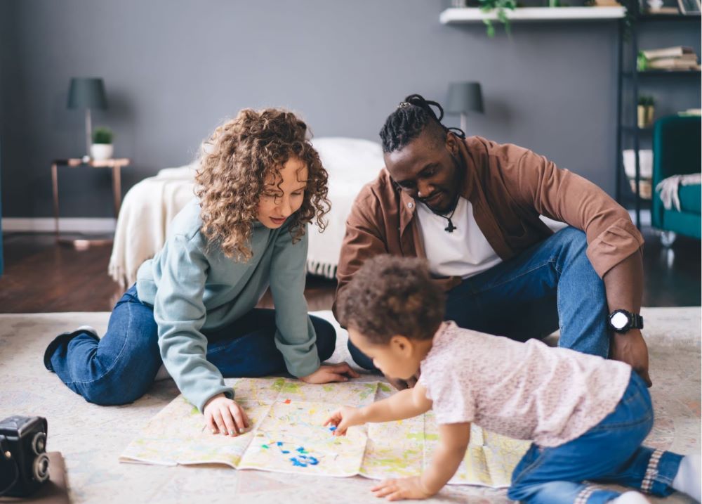 Parent playing with a child in a living room